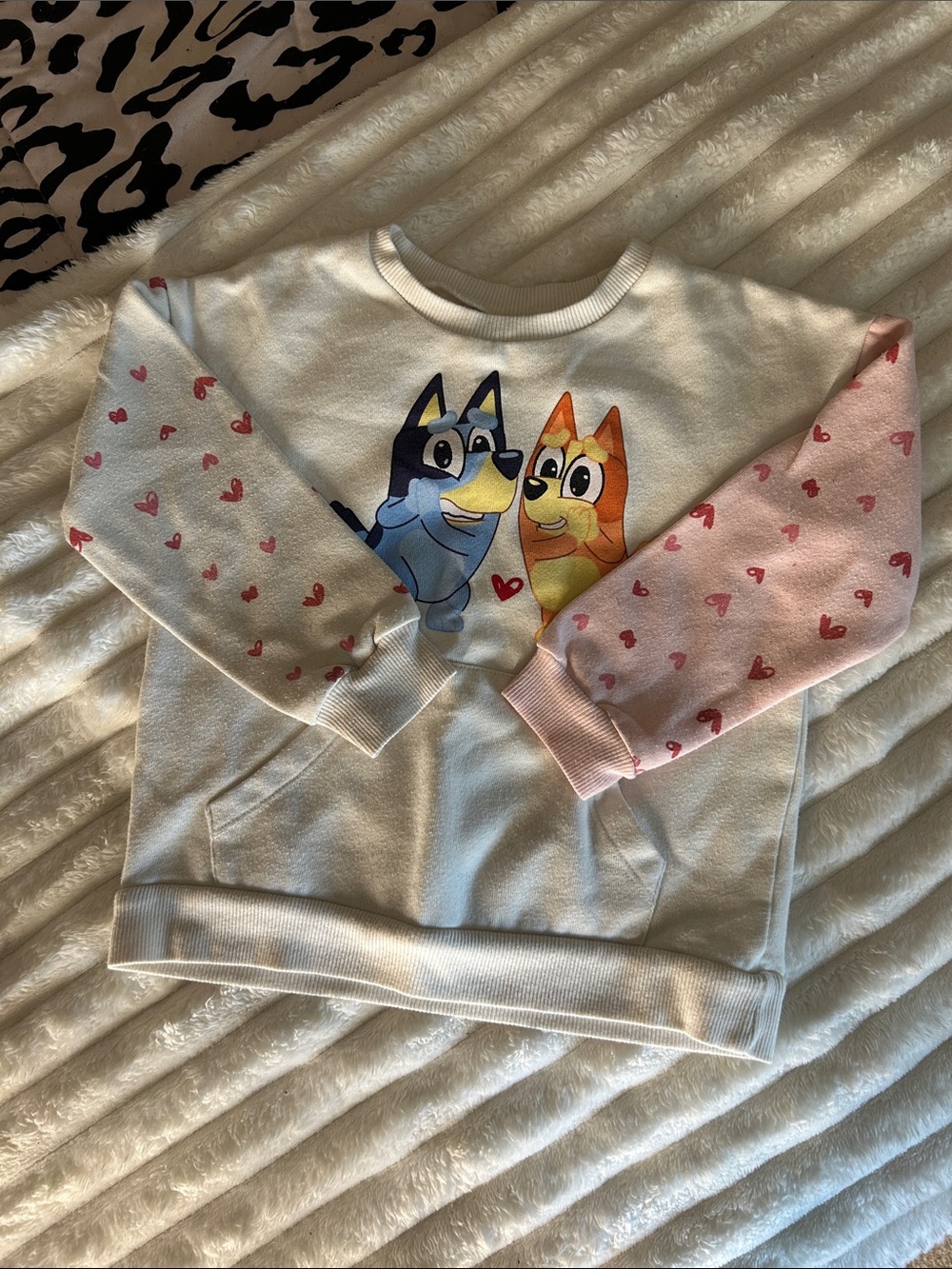 Bluey Valentine's Day pullover sweatshirt featuring a heart print on the sleeves